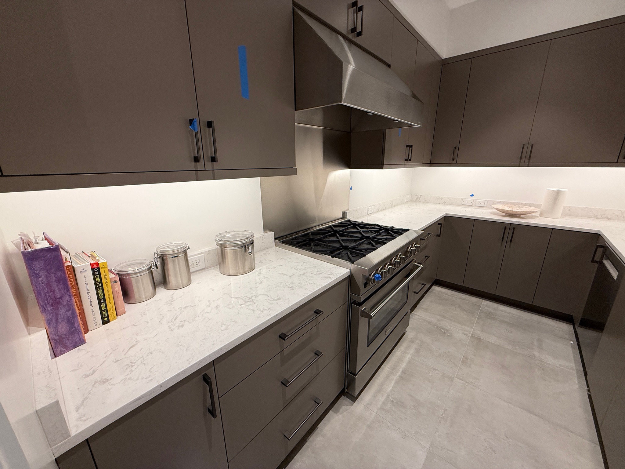 Modern kitchen with premium quartz countertops and waterfall edge