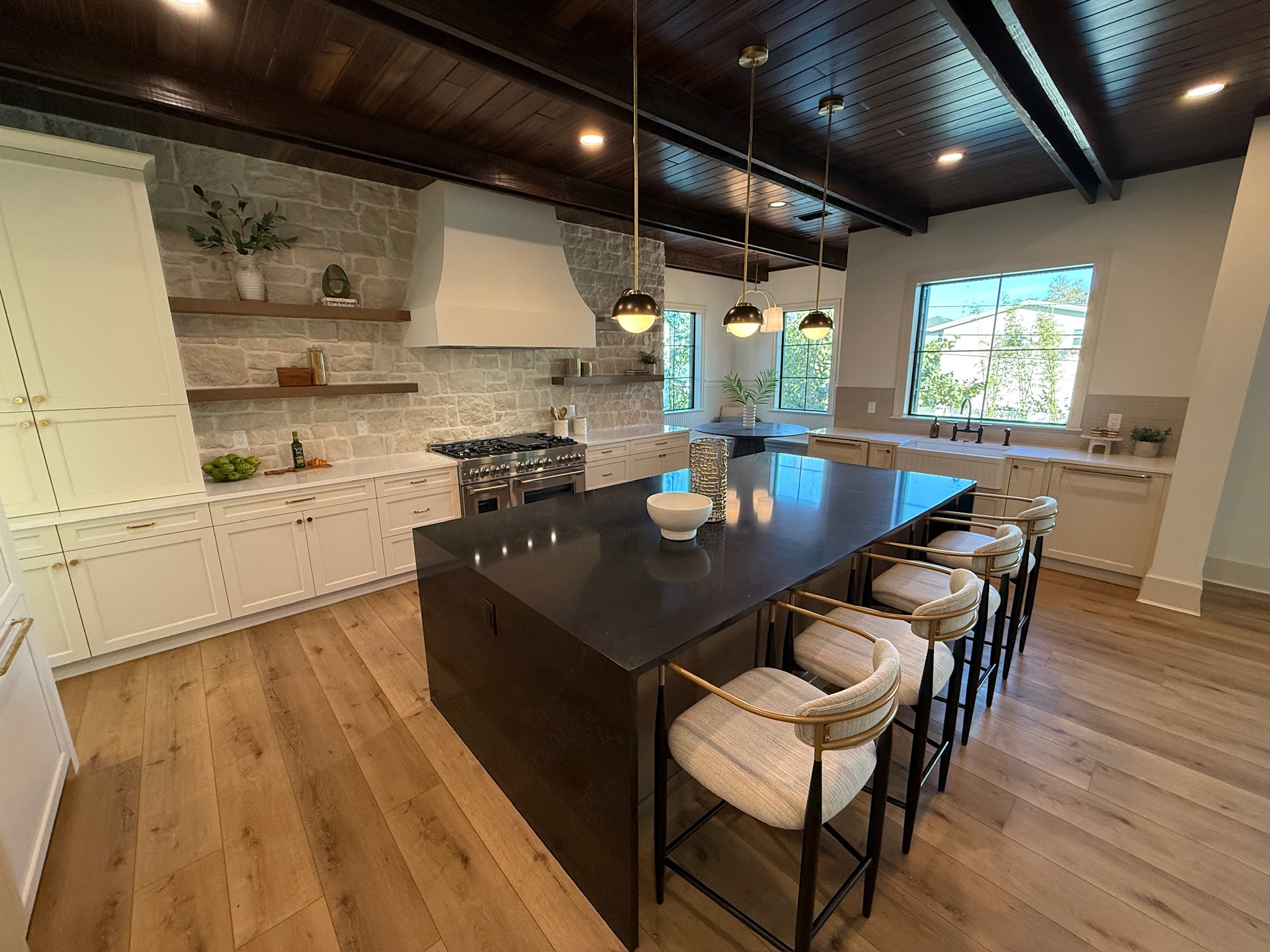 Outdoor kitchen with natural stone countertops and BBQ area